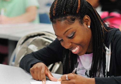 Female student writing something down